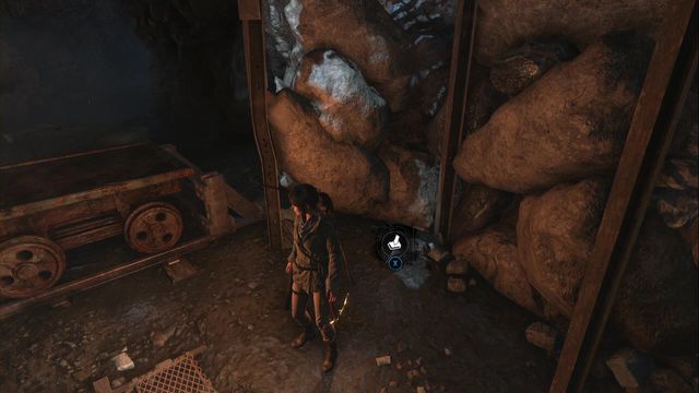 Next to the tracks and the cart, at the rocks, before the elevator shaft entrance - Survival Caches - Abandoned Mine - Rise of the Tomb Raider - Game Guide and Walkthrough