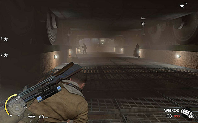 You can find the enemies both under the tank and behind it - Exploring the tank hall - Mission 8 - Ratte Factory - Sniper Elite III: Afrika - Game Guide and Walkthrough