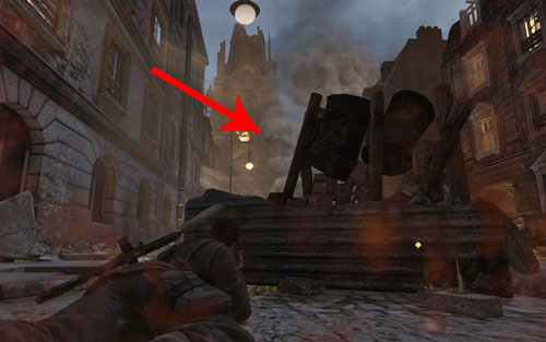 Another sniper is hiding on the church tower, though hes hardly visible because of the smoke - Mission 5 - St. Olibartus Church - p. 1 - Walkthrough - Sniper Elite V2 - Game Guide and Walkthrough