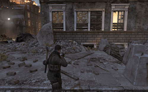 After destroying the first tank, turn into the street on the left - the Gold Bar can be found by the barricade [#1] - Mission 5 - Wine Bottles and Gold Bars - Sniper Elite V2 - Game Guide and Walkthrough