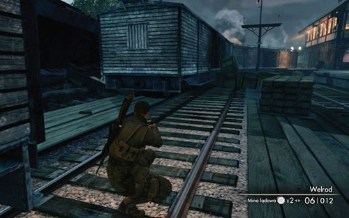 After reaching the rocket launch site, follow the railtracks and you will reach a gap between the train cars [#9], the gold is there - Mission 9 - Wine Bottles and Gold Bars - Sniper Elite V2 - Game Guide and Walkthrough