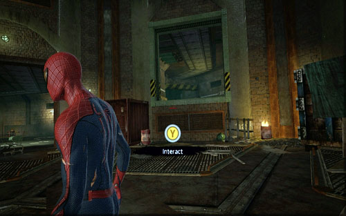 Inside the big room, choose the tunnel with a rectangular entrance and yellow-black stripes, behind which there's a burning barrel - Chapter 04 - The Thrill of the Hunt - Collectibles inside buildings - The Amazing Spider-Man - Game Guide and Walkthrough