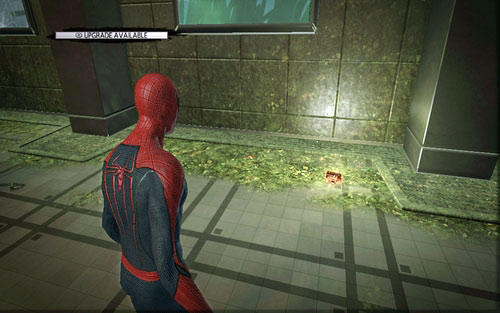 Lying on the ground beside the wall - Chapter 06 - Smythe Strikes Back - p. 1 - Collectibles inside buildings - The Amazing Spider-Man - Game Guide and Walkthrough