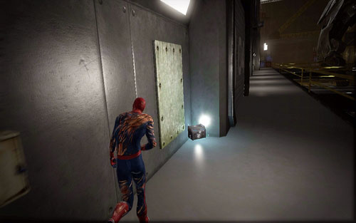 It's at the very end of the walkway with a vehicle with a platform moving by it - Chapter 10 - Spider-Man No More! - p. 2 - Collectibles inside buildings - The Amazing Spider-Man - Game Guide and Walkthrough