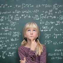  A girl thinking in front of a chalkboard