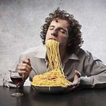  A man eating spaghetti