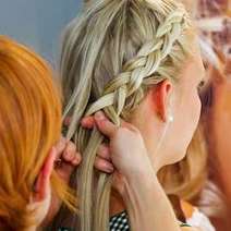  A woman having her hair braided