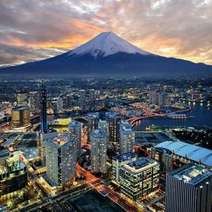 A big city with a high mountain in the background