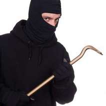  A masked man in black with a hook