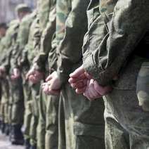  Soldiers with their hands behind back