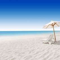 Beach with a beach chair and umbrella