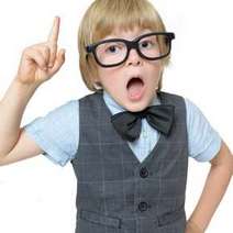 Boy wearing glasses with raised forefinger