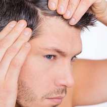 Young man making his hair apart