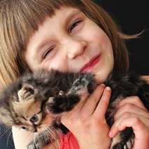 Girl cuddling a cat