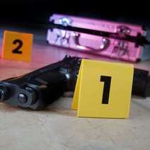 Gun and briefcase marked with numbers one and two