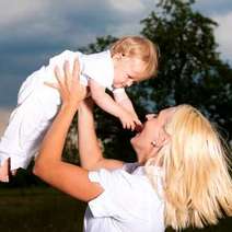 Mother lifting a child