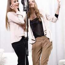  Two girls singing in a studio