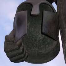  Statue holding armor helmet