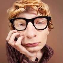  A boy wearing black glasses