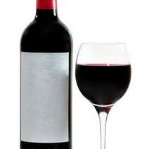 A bottle and a glass with red wine