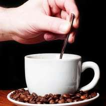  Hand stirring the coffee