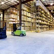  Green forklift stacker in a stock house