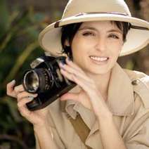  A woman dressed in Safari style with a camera
