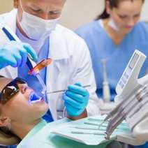 Dentist sealing patient's teeth