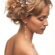  Young woman with fancy hair pin and earrings
