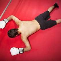  A boxer lying face down after a knockout