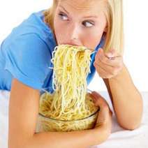  Woman eating lots of spagetti