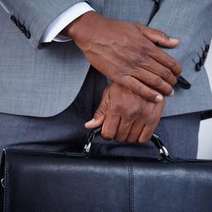  Hands of a business man holding a bag