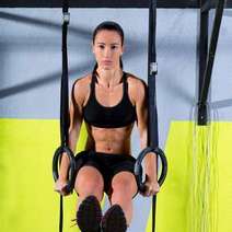  A gymnast holding herself on the rings