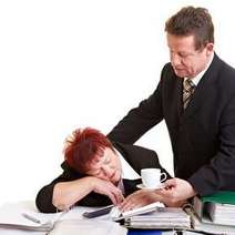  Man waking a woman sleeping on the table