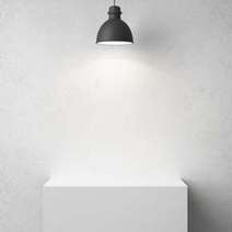 Lamp shining on a white cabinet