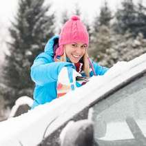  Girl scratching the frozen car window