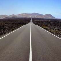  Straight road with mountains in the background