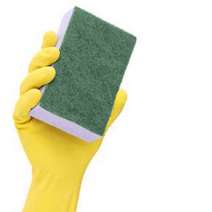  Hand in yellow rubber glove holding a sponge