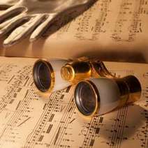  Binoculars and a leather glove laid on the sheet of music 