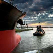  Big ship pulling small ship