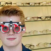 Boy trying glasses 