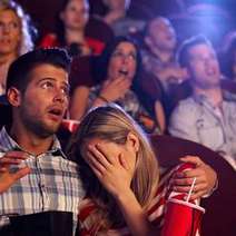 Scared couple in the cinema