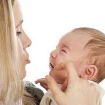  Mother caressing crying baby