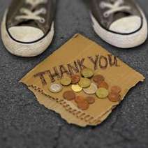  Feet of a beggar with Thank you note and coins