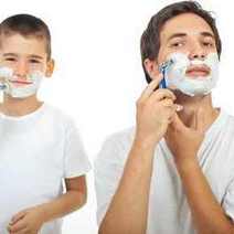 Dad and son shaving 