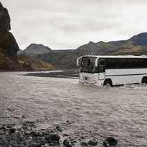 A bus parking in a river