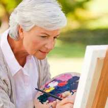 Elderly woman painting
