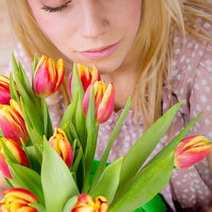  Girl over a bouquet of tulips