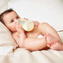  Baby drinking milk from the bottle
