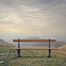 A bench with the view on a hill